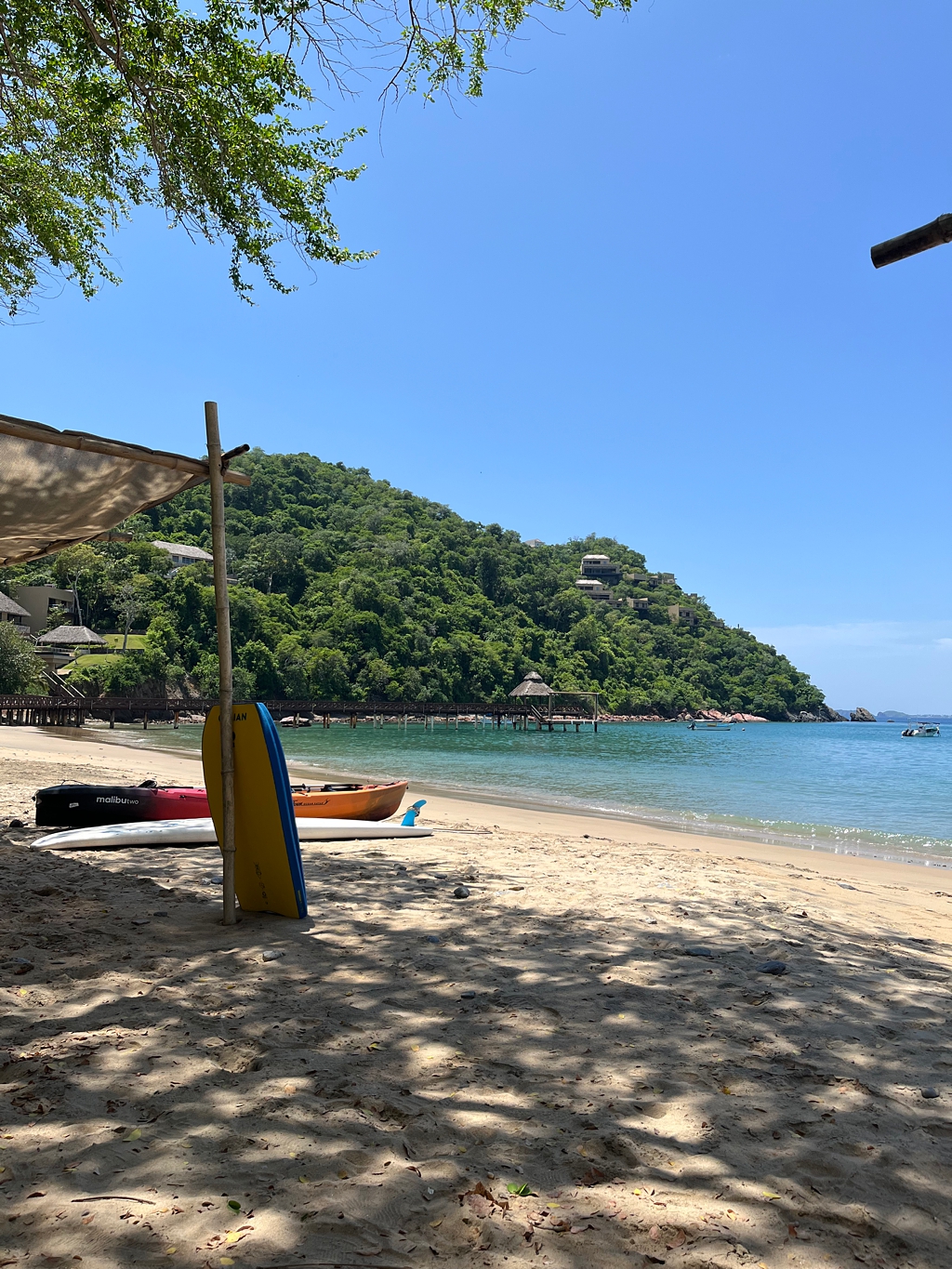 A view of the swimmable beach with toys on the sand