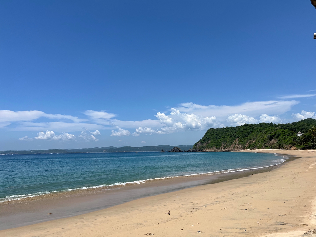 A beautiful curved beach with calm water